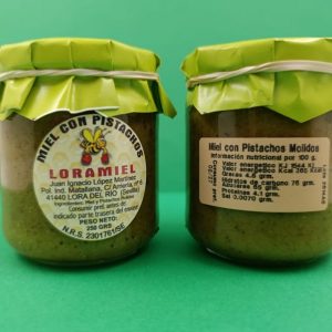 tarro de un cuarto de kilo de miel con pistachos .